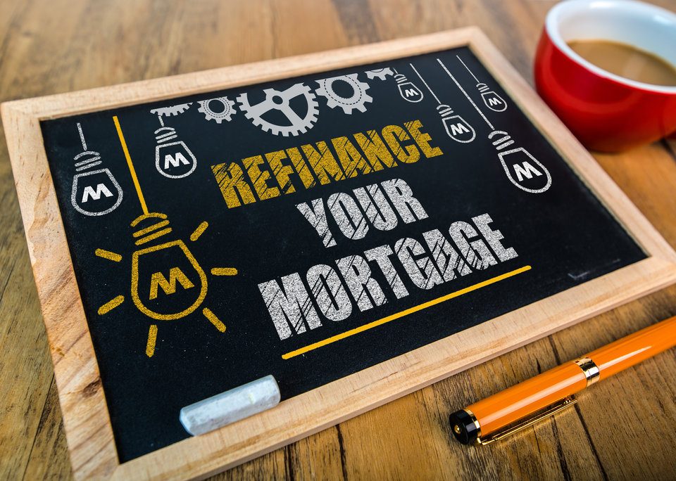 An image of a chalk board prompting "Refinance Your Mortgage"