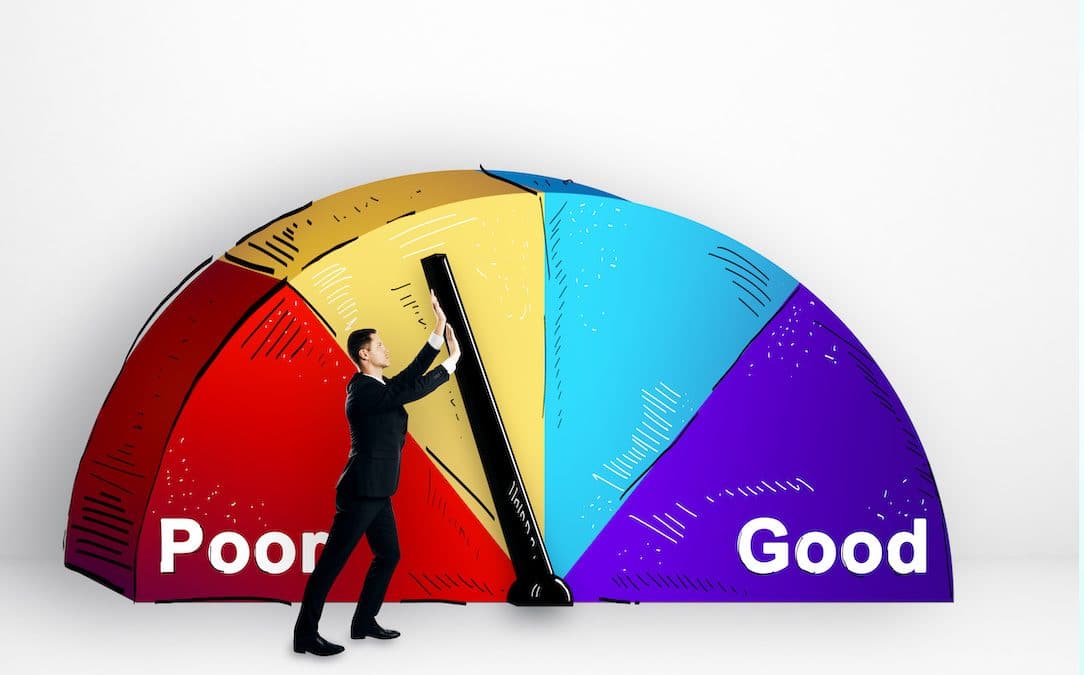 An image of a well dressed man pushing a gauge on a credit score graph.